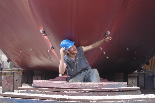 Under the bulbous bow.