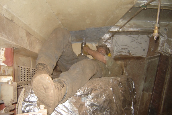 Needle-gunning above ducting - nobody will ever see this part